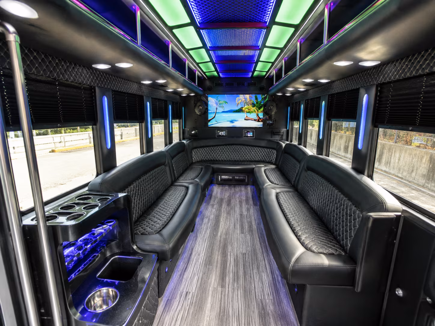 Friends laughing during a party bus celebration in Reno